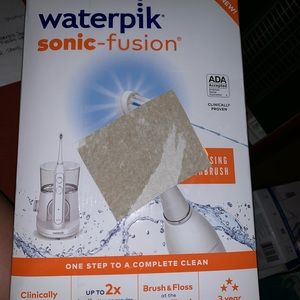 Sonicare flossing toothbrush . New in box